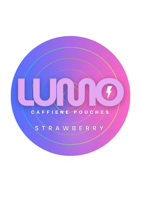 A clean, pink LUMO Strawberry caffeine pouch next to two fresh, ripe strawberries.